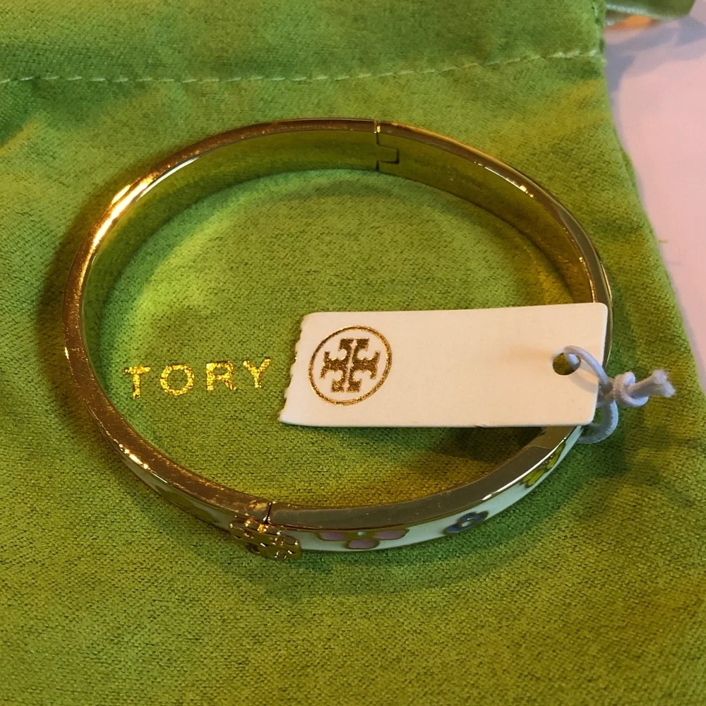 Authentic Tory Burch New/tag and pouch. Enamel Floral Hinge gold tone bracelet.